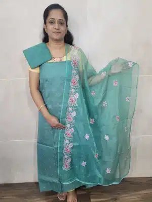 Kota cotton top with embroidered buttas paired with a embroidered soft organza dupatta and cotton silk bottom