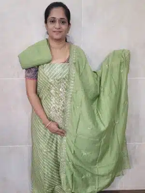 Printed premium quality muslin silk top with a beautiful handwork on yoke paired with a embroidered soft silk dupatta and cotton silk bottom