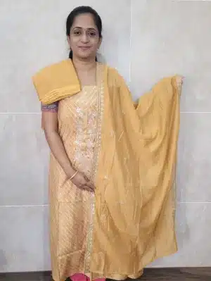 Printed premium quality muslin silk top with a beautiful handwork on yoke paired with a embroidered soft silk dupatta and cotton silk bottom