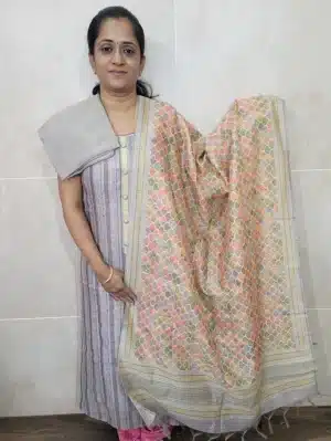 Kantha stitched semi tussar top paired with a digital printed semi tussar dupatta and cotton silk bottom