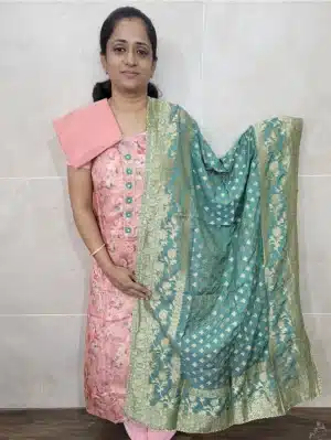 Digital printed dola silk top paired with a benaras weaved soft silk dupatta and cotton silk bottom