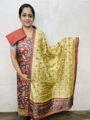 Semi Tussar top paired with a cutworked semi Tussar dupatta and cotton silk bottom