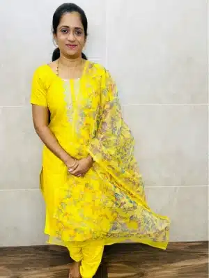 Muslin silk top with embroidered yoke paired with a printed organza dupatta and cotton silk bottom