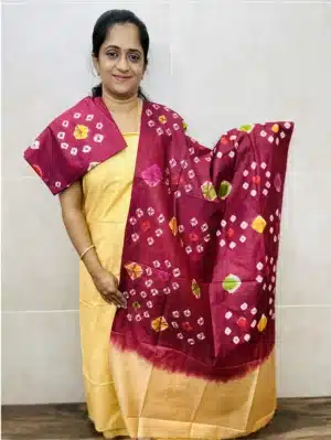Thread weaved semi tussar top paired with a bhandini dyed semi tussar dupatta and semi tussar bottom