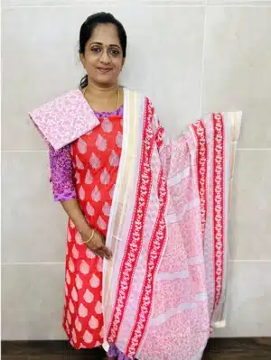 (Dark Peach) Printed cottton top paired with a printed cotton dupatta and cotton bottom