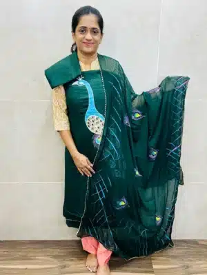 Bottle green - Rayon top with beautiful brush paint work paired with chiffon dupatta and rayon bottom