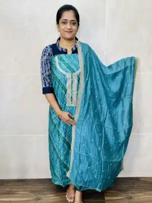 Printed modal silk top with embroidered yoke paired with embroidered soft silk dupatta and cotton silk bottom
