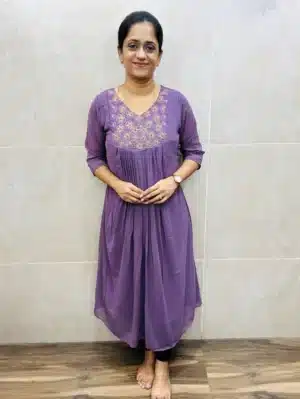 Faux Georgette top(crepe lining)with a beautiful embroidered handworked yoke and pleated flare(Aline pattern)