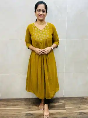 Faux Georgette top(crepe lining)with a beautiful embroidered handworked yoke and pleated flare(Aline pattern)