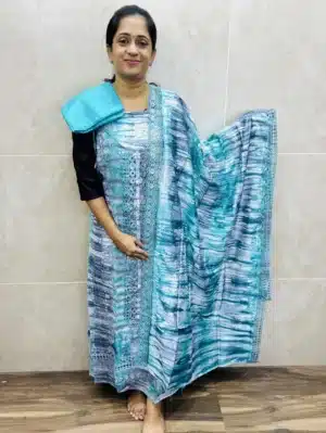 Muslin silk top with allover crochet lace work paired with muslin silk dupatta and cotton silk bottom
