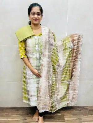 Soft muslin silk top with allover crochet lace and 3d floral work paired with muslin silk dupatta and silk bottom